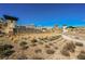 Del Webb Lake Las Vegas community entrance sign with desert landscaping and mountain views at 127 Crimson Cactus Ave, Henderson, NV 89011