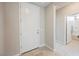 Bright entryway with white door leading to a bath, and tile floors at 127 Crimson Cactus Ave, Henderson, NV 89011