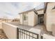 Close up of front door with black metal gate and stylish stone facade at 127 Crimson Cactus Ave, Henderson, NV 89011