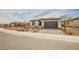 Charming single-story home with a two-car garage and low maintenance desert landscaping at 127 Crimson Cactus Ave, Henderson, NV 89011