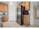 Kitchen featuring stainless steel refrigerator, granite countertops, and ample cabinet space at 127 Crimson Cactus Ave, Henderson, NV 89011