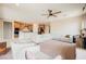 Spacious living room featuring plush seating, ceiling fan, and an open-concept layout with kitchen access at 127 Crimson Cactus Ave, Henderson, NV 89011