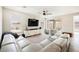 Spacious living room with large sectional sofa and access to the backyard at 127 Crimson Cactus Ave, Henderson, NV 89011