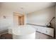 Bright room features a white piano, sleek built-ins, and neutral carpeting at 127 Crimson Cactus Ave, Henderson, NV 89011