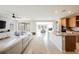 Open-concept living room with hardwood floors, modern furnishings, and gourmet kitchen at 127 Crimson Cactus Ave, Henderson, NV 89011