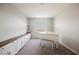 Bright room features a white piano, sleek built-ins, and neutral carpeting at 127 Crimson Cactus Ave, Henderson, NV 89011