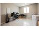 Versatile room featuring tiled floors, computer desk, and laundry machines at 127 Crimson Cactus Ave, Henderson, NV 89011