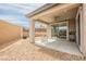 Cozy covered patio with ceiling fan and outdoor seating, offers an inviting space for relaxation at 127 Crimson Cactus Ave, Henderson, NV 89011