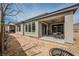 Covered patio extends living space, featuring ceiling fan, with backyard views and easy indoor-outdoor flow at 127 Crimson Cactus Ave, Henderson, NV 89011