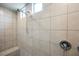 Close-up of step-in shower with tiled walls and dual shower heads at 127 Crimson Cactus Ave, Henderson, NV 89011
