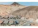Street view showcases modern homes under construction, nestled against a backdrop of majestic desert mountains at 127 Crimson Cactus Ave, Henderson, NV 89011