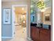 Bathroom entrance featuring a vanity and access to a tub and shower area at 135 E Harmon Ave # 2104, Las Vegas, NV 89109