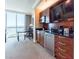 Modern kitchenette with stainless appliances complements the eating area with great views at 135 E Harmon Ave # 2104, Las Vegas, NV 89109