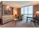 Inviting living room features neutral tones and a large window with stunning city views at 135 E Harmon Ave # 2104, Las Vegas, NV 89109