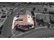 Aerial view of the landscaped backyard with a pool and patio, showcasing privacy and space at 1405 Bugle Boy Dr, Henderson, NV 89014