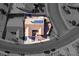 An aerial view highlights the home's solar panels, stucco wall, and landscaping at 1405 Bugle Boy Dr, Henderson, NV 89014