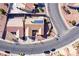 An aerial view of a home with solar panels, landscaping and a stucco wall surrounding the backyard at 1405 Bugle Boy Dr, Henderson, NV 89014