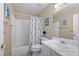 Bathroom featuring a white vanity, tub-shower combo, and neutral wall color at 1405 Bugle Boy Dr, Henderson, NV 89014