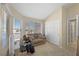 Bedroom featuring two windows allowing natural light and a closet with sliding doors at 1405 Bugle Boy Dr, Henderson, NV 89014