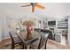 Open dining area connecting to the living room, with a ceiling fan and stylish decor at 1405 Bugle Boy Dr, Henderson, NV 89014