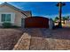 Brick-lined driveway leading to a gated entrance surrounded by desert landscape at 1405 Bugle Boy Dr, Henderson, NV 89014