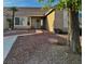 Welcoming front entrance with desert landscaping and a decorative wreath on the door at 1405 Bugle Boy Dr, Henderson, NV 89014