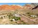 Stunning aerial view of a rural property nestled amidst majestic mountains, showcasing the natural beauty and serene surroundings at 14525 Heyer Way, Las Vegas, NV 89161