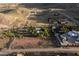 Expansive aerial view of property, showcasing the desert landscape and surrounding mountains at 14525 Heyer Way, Las Vegas, NV 89161