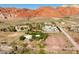Picturesque desert homes surrounded by native desert foliage against the majestic Red Rock Mountains at 14525 Heyer Way, Las Vegas, NV 89161