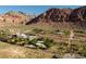 Stunning aerial view of the desert property, featuring majestic mountains in the distance at 14525 Heyer Way, Las Vegas, NV 89161