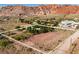 Generous lot surrounded by native desert landscape with mountain views and defined property lines at 14525 Heyer Way, Las Vegas, NV 89161