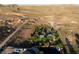 An aerial view of the property, highlighting the home and its lush surroundings in the desert landscape at 14525 Heyer Way, Las Vegas, NV 89161