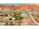 Beautiful desert homes with mature trees nestled in a scenic landscape against the Red Rock Mountains at 14525 Heyer Way, Las Vegas, NV 89161