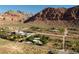 Expansive lot with mature trees, mountain views, and an outline of the property lines at 14525 Heyer Way, Las Vegas, NV 89161