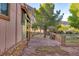 Spacious backyard patio with stone pavers, offering a relaxing outdoor retreat with views of the surrounding landscape at 14525 Heyer Way, Las Vegas, NV 89161