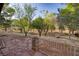 Private backyard with a stone patio and beautiful mountain views amidst mature trees at 14525 Heyer Way, Las Vegas, NV 89161