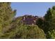 Scenic view of a rocky mountain peak framed by lush green trees at 14525 Heyer Way, Las Vegas, NV 89161