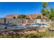 Backyard pool with mountain views and desert landscaping, and lounge chairs at 14525 Heyer Way, Las Vegas, NV 89161