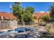 Tranquil backyard pool with mountain views, surrounded by desert landscaping and fencing at 14525 Heyer Way, Las Vegas, NV 89161