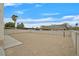 Large, enclosed backyard featuring neutral ground cover, concrete patio, and tall privacy walls for secluded outdoor space at 15 Richland Acres Ct, Henderson, NV 89074