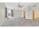 Bright bedroom with ceiling fan, large windows, walk-in closet and an ensuite bathroom at 15 Richland Acres Ct, Henderson, NV 89074