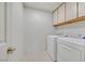 Functional laundry room with appliances and cabinets, offering convenience and storage at 15 Richland Acres Ct, Henderson, NV 89074