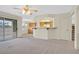 Cozy living space with patio access, a partial kitchen view, and staircase access, offers a versatile layout at 15 Richland Acres Ct, Henderson, NV 89074