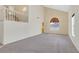 Spacious living room features neutral carpet and ample natural light from large windows at 15 Richland Acres Ct, Henderson, NV 89074