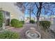 Lovely backyard featuring a paver patio, rock garden and mature trees at 1712 Warrenville St, Las Vegas, NV 89117