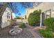 Charming backyard with mature trees, a rock garden, and a stone walkway at 1712 Warrenville St, Las Vegas, NV 89117