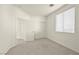 Neutral bedroom featuring carpet, a double door closet, and natural light coming in through a window at 1712 Warrenville St, Las Vegas, NV 89117