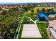 Aerial view of community park with playground, volleyball court, and walking trails; perfect for Gathering fun at 1712 Warrenville St, Las Vegas, NV 89117