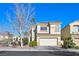 Charming two-story home featuring a well-manicured front yard and a classic tile roof at 1712 Warrenville St, Las Vegas, NV 89117
