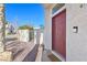Close-up of the home's entry, featuring a modern doorbell and a freshly painted door at 1712 Warrenville St, Las Vegas, NV 89117